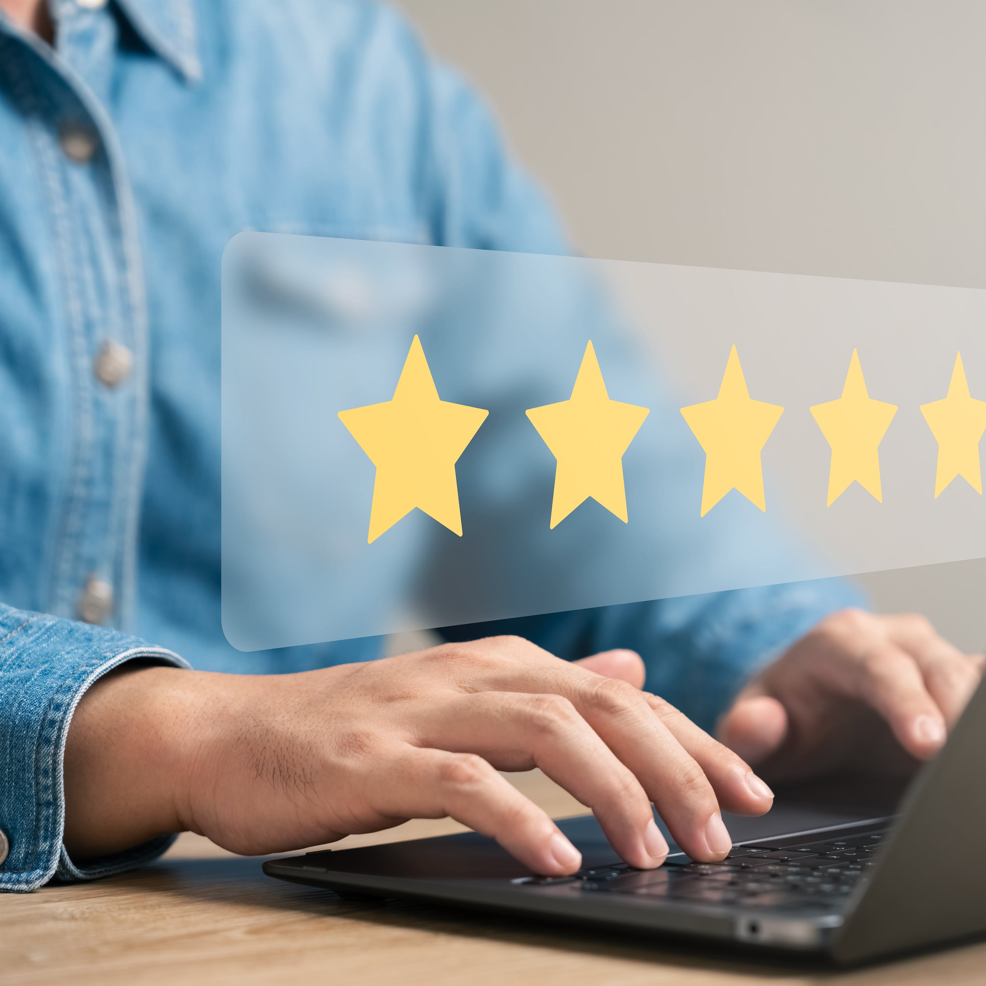 Person using a laptop with five yellow stars overlayed on the screen